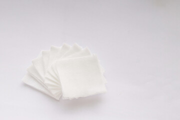 Pile of pad gauzes on white background