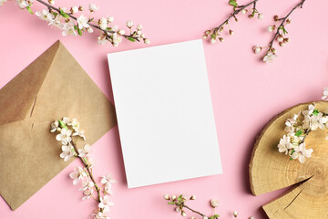 Greeting card mockup with white flowers on pink background