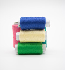 Sewing thread and bobbin isolated on white background, spool, yarn on tube, cotton, wool