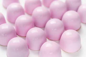 Exclusive handmade chocolate candy painted with pastel colo