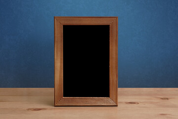frame on table, blue wall