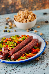 fried veggie sausages served with grilled vegs