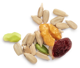 Heap of nuts and seeds isolated over the white background. Creative layout made of cereal mix, with dried fruit and seeds.