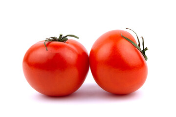 Two Juicy red tomatoes isolated on a white background.