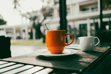 Coffee in a cup with a warm morning seaside breakfast.