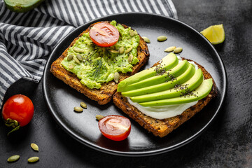 Healthy avocado toasts for breakfast or lunch with cherry tomato, rye bread and cream cheese, pumpkin seeds. Breakfast with vegetarian food, diet concept