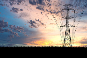 High voltage power transmission towers Have a complex steel structure In the evening. high-voltage power lines at sunset,high voltage electric transmission tower