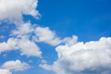 Natural daylight and white clouds floating on blue sky. Concept of freedom and relaxation.