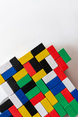 Fototapeta na wymiar plenty of multicolored blocks on white background with copy space, top view.