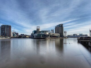 Naklejka premium Urban landscape with modern buildings in and around Salford Quays. 