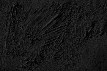 Black grungy wall plaster texture.