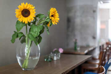 sunflowers in a vase on a table