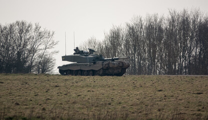 British army FV4034 Challenger 2 main battle tank with Commander and gunner directing, in action on...