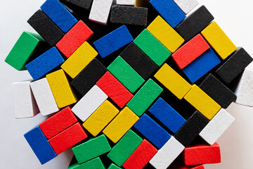 top view of tetragonal multicolored blocks on white background.