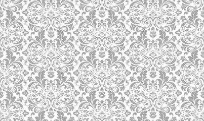 Obraz premium Wallpaper in the style of Baroque. Seamless vector background. White and gray floral ornament. Graphic pattern for fabric, wallpaper, packaging. Ornate Damask flower ornament.
