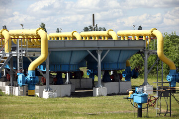 Gas transportation system. Booster pumping station for gas. Gas filling station and gas tanks. Transportation of gas around the world. Oil and gas sector. Gas turbines.