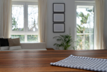 Wooden desk with napkin in modern  living room interior and free space for your decoration