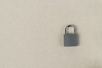 Padlock closed on a gray background close-up. Security concept