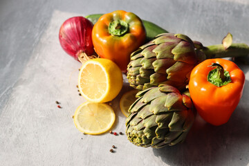 Close up photo of two artichokes on textured background with copy space. Beautiful artichoke...