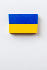 top view of blue and yellow blocks on white background with copy space, ukrainian concept.