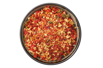 Bowl of spice mix for cooking dishes, isolated on white. Flakes of red hot pepper, paprika, garlic, onion. Dried seasoning closeup. Top view.