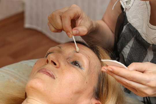 Correction and Tint Henna of Eyebrows, Master Applies to Woman Marking on Brows, Close up