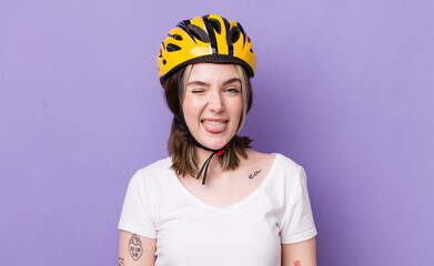 pretty caucasian woman with cheerful and rebellious attitude, joking and sticking tongue out....