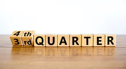 Foto op Plexiglas From 3rd third to 4th forth quarter symbol. Turned wooden cubes and changed words 3rd quarter to 4th quarter. Beautiful wooden table white background. Business happy 4th quarter concept. Copy space. © Dzmitry