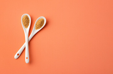 Amaranthus - Organic amaranth seeds in two ceramic spoons