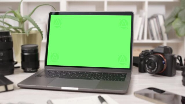 Tablet Computer with Green Screen in Creative Office Interior