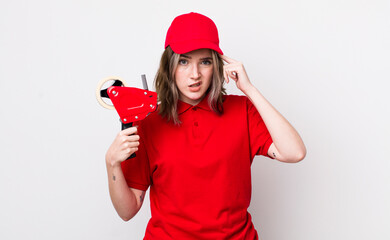 pretty caucasian woman feeling confused and puzzled, showing you are insane. packer concept