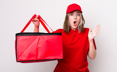pretty caucasian woman amazed, shocked and astonished with an unbelievable surprise. pizza delivery...