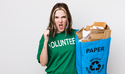 pretty caucasian woman shouting aggressively with an angry expression. ecology concept