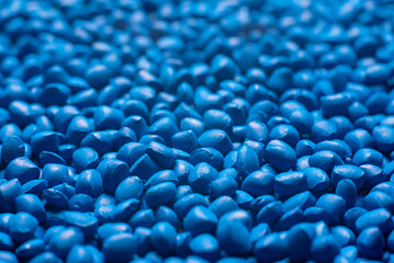 Blue polymer dye in granules, background texture