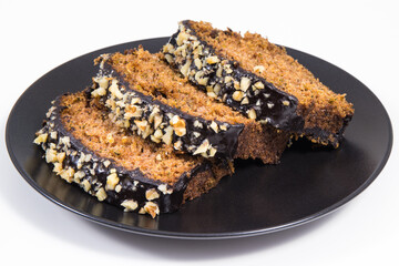 Homemade pastry made of zucchini with nuts and raisin. White background