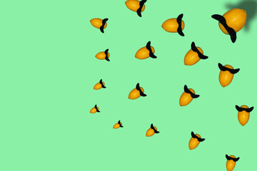 creative pattern lemon with a mustache that speaks to other lemons, pastel green background with copy space, creative design