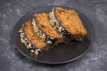 Homemade pastry made of zucchini with nuts and raisin on backgrond of concrete