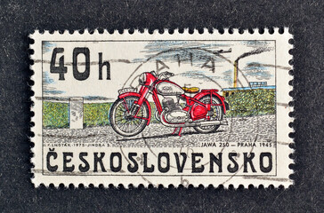 Cancelled postage stamp printed by Czechoslovakia, that shows Jawa motorcycle 250, Praha (1945), circa 1975. - obrazy, fototapety, plakaty