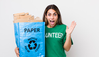 pretty hispanic woman feeling happy and astonished at something unbelievable. ecology concept