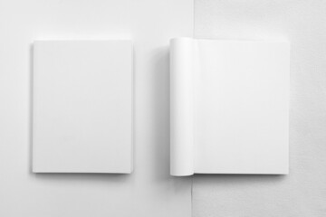 Mockup of brochure with fold. Blank mock up of booklet, menu and book. White paper of magazine. Mockup of leaflet. Template of twofold pamphlet isolated on white background.