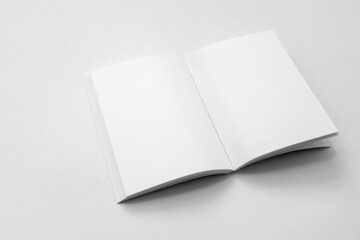Mockup of brochure with fold. Blank mock up of booklet, menu and book. White paper of magazine. Mockup of leaflet. Template of twofold pamphlet isolated on white background.