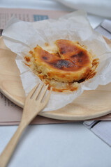 Delicious Cheesecake on a wood dish with wood fork, Cheesecake on a table