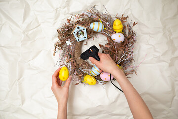 Easter wreath hand made. Colored Eggs and Chickens Home Decoration Glue Gun DIY