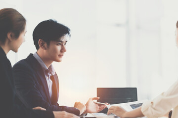 Asian Business consultant working together and management big data and analyze financial budget of company. Fund investment concept.