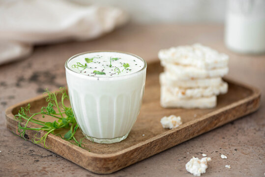 homemade natural kefir with rice cakes in a glass