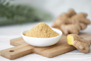 ginger root powder in a white bowl