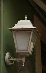 Italy: Old white street lamp.
