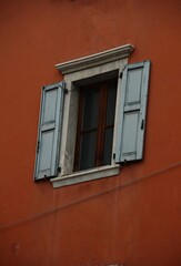 Italy, Trentino: Open window of the red house.