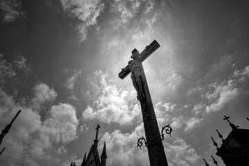 Backlit cemetery cross