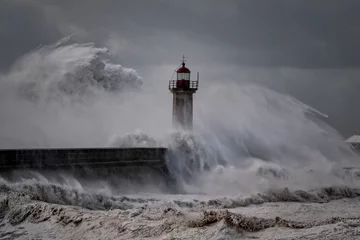 Foto auf Acrylglas Stormy waves over old lighthouse © Zacarias da Mata